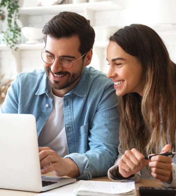 couple searching on laptop